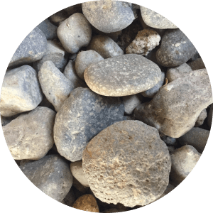 An up close view of pebbles and small to medium sized cobbles.